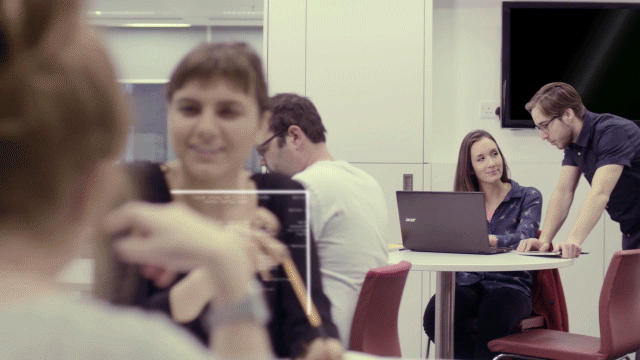 Graphic & Live Action Film - staff discussing work in office gif